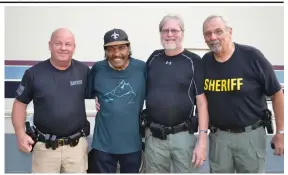  ?? (Special to The Commercial/Richard Ledbetter) ?? Bobby Rush stands next to the Dallas County deputies who provided security for the Veterans Blues Fest on Saturday.