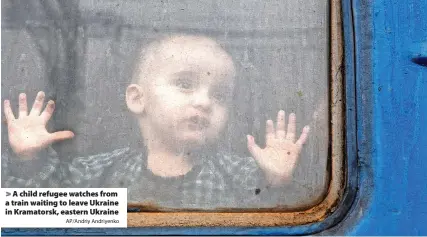 ?? AP/Andriy Andriyenko ?? A child refugee watches from a train waiting to leave Ukraine in Kramatorsk, eastern Ukraine