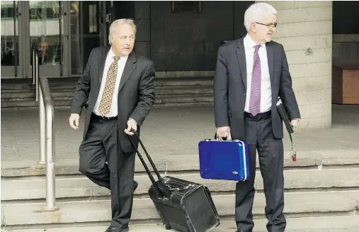  ?? FRANCIS VACHON FOR NATIONAL POST ?? Two weeks before Quebec Superior Court Justice Michel Girouard, left, was named to the bench in 2010, a security camera
recorded him allegedly buying illicit drugs in the back office of a video store. Girouard denies the allegation­s.