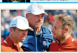  ??  ?? EMOTIONAL: Casey, left, and Hatton after their victory in the fourballs