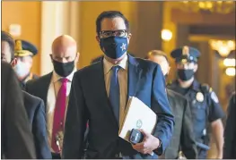  ?? MANUEL BALCE CENETA — THE ASSOCIATED PRESS ?? Treasury Secretary Steven Mnuchin walks from the office of Senate Majority Leader Sen. Mitch McConnell, R-Ky., as he leaves the Capitol in Washington on Sept. 30.