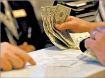  ?? ANTONIO PEREZ/CHICAGO TRIBUNE ?? Gamblers place bets on Chicago sports teams Sept. 4 during the opening of The Book at the Horseshoe Hammond Casino in Hammond.