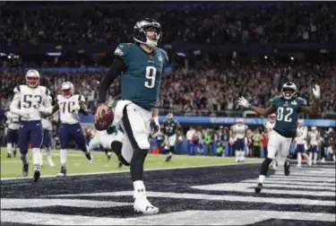  ?? JEFF ROBERSON — ASSOCIATED PRESS ?? Eagles quarterbac­k Nick Foles celebrates his touchdown catch during the first half Super Bowl 52.