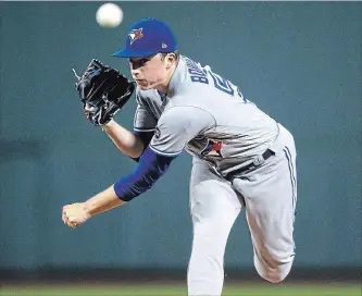  ?? CHARLES KRUPA THE ASSOCIATED PRESS ?? Toronto Blue Jays starting pitcher Ryan Borucki delivers in the first inning of an American League baseball game against the Red Sox at Fenway Park in Boston on Tuesday night. For the game result, visit thespec.com.