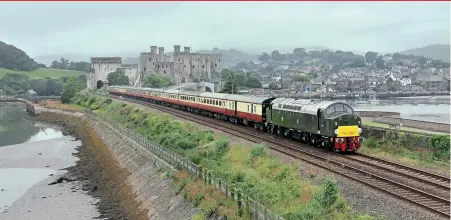  ??  ?? LEFT: With Conwy Castle prominent in the background, and in rather overcast weather conditions, recently-repaired D213 Andania heads ‘The Bristol Forty’ tour from Bangor to Bristol Temple Meads on July 1. Terry Eyres