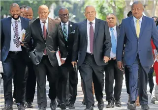  ?? /Ruvan Boshoff ?? A-Team: Finance Minister Pravin Gordhan, third from right, his deputy Mcebisi Jonas, second from left, Treasury directorge­neral Lungisa Fuzile, far right, and other senior officials arrive at the National Assembly for the 2017 budget speech on Wednesday.