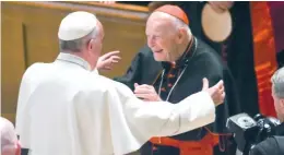  ?? JONATHAN NEWTON/THE WASHINGTON POST VIA AP/POOL ?? Pope Francis reaches out to hug former Washington D.C. archbishop Theodore McCarrick in 2015.