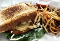  ?? Arkansas Democrat-Gazette/CELIA STOREY ?? The Don’t Be Chick’n sandwich (with a side of Spiral Out Fries) does not taste at all like a cauliflowe­r sandwich on Texas Toast.