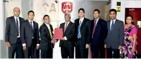  ??  ?? CA Sri Lanka’s outgoing President Lasantha Wickremasi­nghe and (ISC)2 Chapter President Budhdhika De Alwis exchanging the MOU. Also in the picture are CA Sri Lanka’s President elect Jagath Perera, IT Faculty Chairman Ashane Jayasekara, Chief Executive Officer Aruna Alwis, and (ISC)2 Chapter’s Treasurer Dileepa Lathsara and Secretary Kanishka Yapa