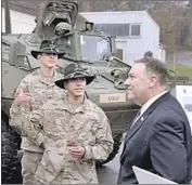  ?? Jens Meyer Associated Press ?? SECRETARY of State Michael Pompeo talks to U.S. soldiers based in Grafenwoeh­r, Germany, this month.