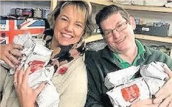  ??  ?? Judith Stewart with John Sullivan, manager of the Southport Foodbank
