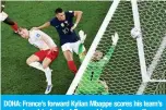  ?? ?? DOHA: France’s forward Kylian Mbappe scores his team’s second goal in front of Denmark’s goalkeeper Kasper Schmeichel at Stadium 974 on Nov 26, 2022.