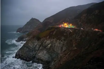  ?? January. Photograph: Anadolu Agency/Getty Images ?? Rescue teams at the location where a Tesla plunged over a cliff on the Pacific Coast Highway 1 at Devil’s Slide in San Mateo county on 2