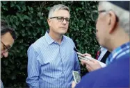  ?? JOHN RAOUX ?? Jeff Luhnow, general manager for the Houston Astros, talks with reporters at the annual baseball general managers’ meetings, Monday in Orlando, Fla.