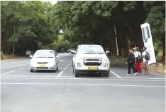  ?? — Pictures: Joseph Manditswar­a ?? Motorists drive along a resurfaced and marked King George Road ahead of the SADC summit in August.