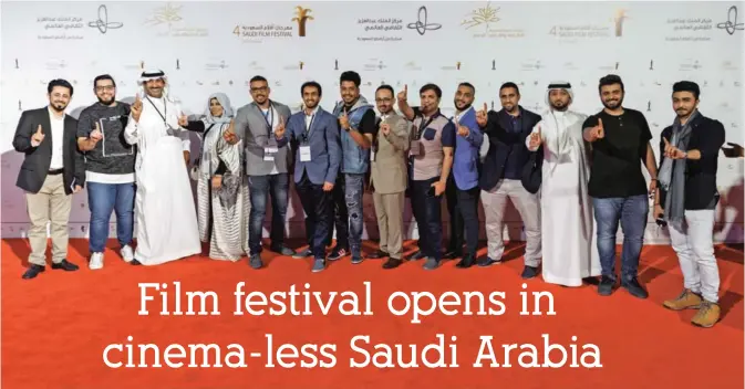 ??  ?? A picture taken on Monday shows Saudi actors posing before the opening ceremony of the fourth Saudi Film Festival held in Dammam City, 400 kilometers east from Saudi capital Riyadh. — AFP photos
