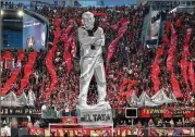  ?? CURTIS COMPTON / CCOMPTON@AJC.COM ?? Atlanta United fans raise a tifo of head coach Gerardo Martino to start the game against NYCFC during the second leg of their MLS Eastern Conference semifinal on Sunday in Atlanta.