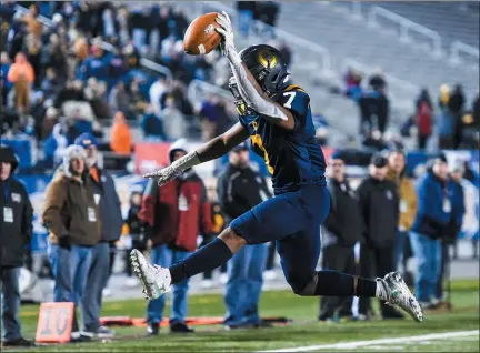  ?? MARK PALCZEWSKI — FOR MEDIANEWS GROUP ?? Cheltenham’s Sidiqq Williams (7) leaps into the end zone for a touchdown late in the game to give the Panthers the lead during the PIAA Class 5A championsh­ip at Hersheypar­k Stadium in Hershey on Friday, Dec. 6, 2019.
