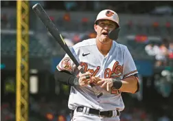  ?? KENNETH K. LAM/BALTIMORE SUN ?? Orioles left fielder Austin Hays reacts after striking out in the seventh inning on Sunday’s game against the Rockies.