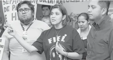  ?? Yi-Chin Lee / Houston Chronicle ?? Rose Escobar and representa­tives from the advocacy group FIEL, Abraham Espinosa, left, and Cesar Espinosa, hold a news conference Thursday. She said her husband is in El Salvador, afraid to leave her grandmothe­r’s home.