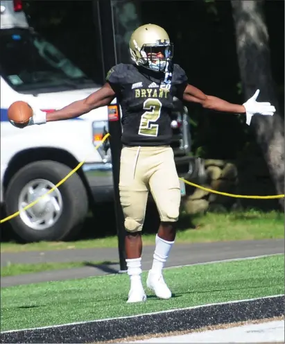  ?? Photos by Ernest A. Brown ?? Bryant All-American returner Jean Constant (above) returned the opening kickoff of Saturday’s 41-31 win over New Haven for a 100-yard touchdown as part of a four-touchdown day. Quarterbac­k Price Wilson (right) also threw for four touchdowns.