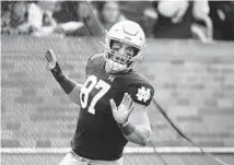  ?? DARRON CUMMINGS/AP ?? Notre Dame tight end Michael Mayer celebrates after a touchdown reception during the first half Saturday in South Bend, Ind.