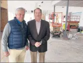  ?? KENNETH R. GOSSELIN/HARTFORD COURANT ?? Mark Mitchell, coowner of Mitchell Auto Group, at left, and Dave Tefft, managing general partner, in what will be the showroom of their Land Rover dealership in Hartford.