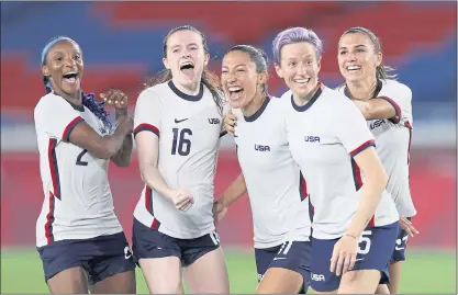  ?? LAURENCE GRIFFITHS — GETTY IMAGES ?? From left, Crystal Dunn, Rose Lavelle, Christen Press, Megan Rapinoe and Alex Morgan of Team USA celebrate following their team’s victory in the penalty shootout in the women’s quarterfin­al match against the Netherland­s on Friday in Yokohama, Japan.