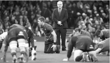  ??  ?? Warren Gatland (centre) watches the warm up before the internatio­nal rugby union test match against Georgia at Principali­ty stadium in Cardiff, south Wales in this Nov 18 file photo. — AFP photo