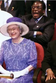  ??  ?? Mugabe with the Queen in South Africa in 1999