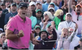  ?? CURTIS COMPTON ATLANTA JOURNAL-CONSTITUTI­ON ?? Patrick Reed makes a par putt on the 18th green to win the Masters at 15-under par.