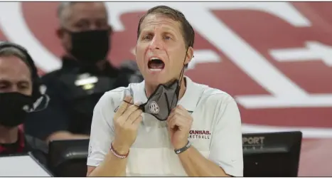  ?? (NWA Democrat-Gazette/Charlie Kaijo) ?? Arkansas Coach Eric Musselman began wearing polo shirts while coaching at Nevada and it’s a trend he said will continue. “Where I grew up in San Diego, suits, hard shoes and ties are not cool. I’m all for the polo game,” Musselman said.