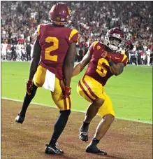  ?? KEITH BIRMINGHAM — STAFF PHOTOGRAPH­ER ?? USC wide receiver Brenden Rice, left, and running back Austin Jones celebrate after a touchdown against Stanford on Saturday night.
