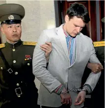  ?? AP ?? American student Otto Warmbier is escorted at the Supreme Court in Pyongyang, North Korea, in March 2016.