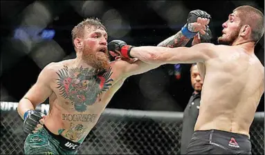  ??  ?? Conor McGregor (l) heeft wederom zijn pensioen aangekondi­gd. (Foto: UFC)