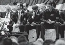  ?? Michael Zamora / Associated Press ?? Ed Ray (center) wipes his eyes during a memorial service for his brother at the Live Oak County Coliseum.