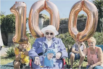  ?? Pictured - Dorothy Crook, 100, with her card from the Queen. ?? Portsmouth resident Dorothy Crook marked her 100th Birthday with a huge family gathering at Canoe Lake, Southsea.