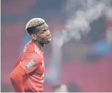  ?? — AFP photo ?? Manchester United’s Paul Pogba reacts during the English League Cup semi final against Manchester City at Old Trafford in Manchester.