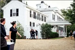  ?? (The New York Times/Gabriela Herman) ?? Workers with Buckley’s Gourmet Catering continue preparatio­ns for a wedding at the Dr. Daniel Fisher House in Edgartown on the island of Martha’s Vineyard, Mass. on Aug. 5, 2023. The nearly 100-square-mile island is a popular destinatio­n for couples seeking a picturesqu­e destinatio­n. But some residents who work these lavish nuptials face hardships beyond the aisle.