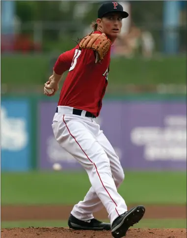  ?? Photo by Louriann Mardo-Zayat / lmzartwork­s.com ?? After allowing seven of the first 10 Rochester hitters to reach base Sunday, PawSox lefty Henry Owens settled down and set down 17 of the final 18 batters he faced. Owens allowed two runs in seven innings in a 3-2 defeat to the Wings.