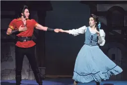  ??  ?? Belle (Jill-Christine Wiley) fends off Gaston (JT Nelson) in “Beauty and the Beast.”