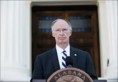  ?? ALBERT CESARE /THE MONTGOMERY ADVERTISER VIA THE ASSOCIATED PRESS ?? Alabama Gov. Robert Bentley speaks during a news conference on Friday outside the Alabama Capitol building in Montgomery, Ala. Bentley vowed again he won’t resign even as his political troubles mounted and lawmakers said they would move forward with...