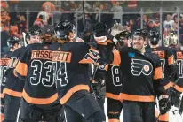  ?? TIM NWACHUKWU/GETTY ?? The Flyers’ Owen Tippett (74) and Louie Belpedio (37) react after defeating the Vegas Golden Knights on Saturday at the Wells Fargo Center in Philadelph­ia.
