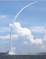 ?? ZHA CHUNMING, XINHUA NEWS AGENCY, VIA AP ?? A Chinese frigate launches a missile from the waters between Hainan Island and Paracel Islands on July 8 during a week of military drills.