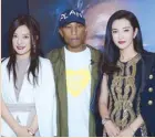  ??  ?? Zhao We and Li Bingbing with Pharrell Williams