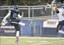  ?? Matt Freed/Post-Gazette ?? West Allegheny's Logan Malatak blocks a punt by Woodland Hills' Michael Whiteherse last Friday.