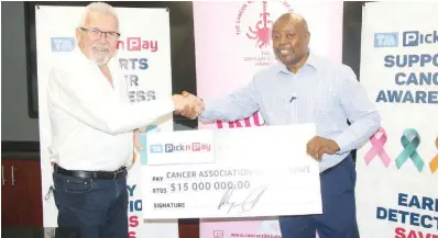  ?? ?? TM Pick n Pay managing director Malcolm Mycroft (left) hands over a $15 million cheque to Cancer Associatio­n of Zimbabwe chairperso­n Eugene Mlambo in support of the organisati­on’s breast cancer awareness initiative­s