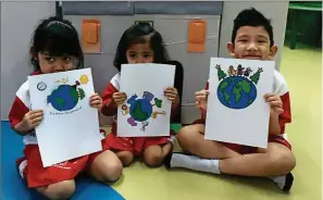  ??  ?? To commemorat­e Earth Day, students of Smart Reader Kids Desa Sri Hartamas performed creative arts and built a castle from a refrigerat­or box.