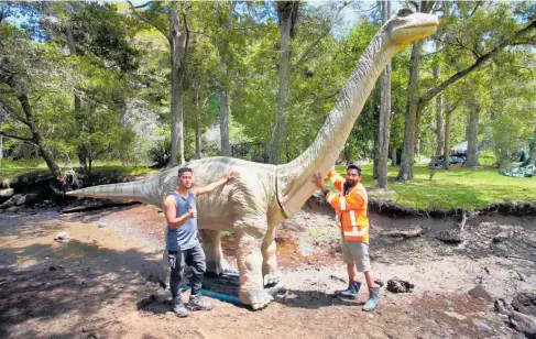  ?? Photo / Tania Whyte ?? Reuben Rata and Babinder Singh Madahar set up one of the Dinofest prehistori­c giants in Whanga¯ rei’s Mair Park on Tuesday. The event runs until Sunday.