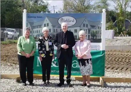  ?? PHOTO PROVIDED ?? Left to right, Sr. Kay Ryan, CSJ, Sister Charla Commins, CSJ, The Most Reverend Howard J. Hubbard, Bishop Emeritus, and Sr. Lauren VanDermark, CSJ pose in front of the constructi­on site of Shaker Pointe’s new building, Parkland at Shaker Pointe, which will offer rental opportunit­ies for residents.